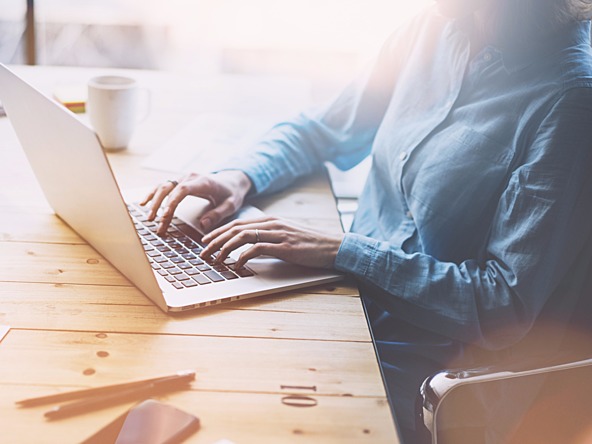 Woman sitting at a desk using a laptop